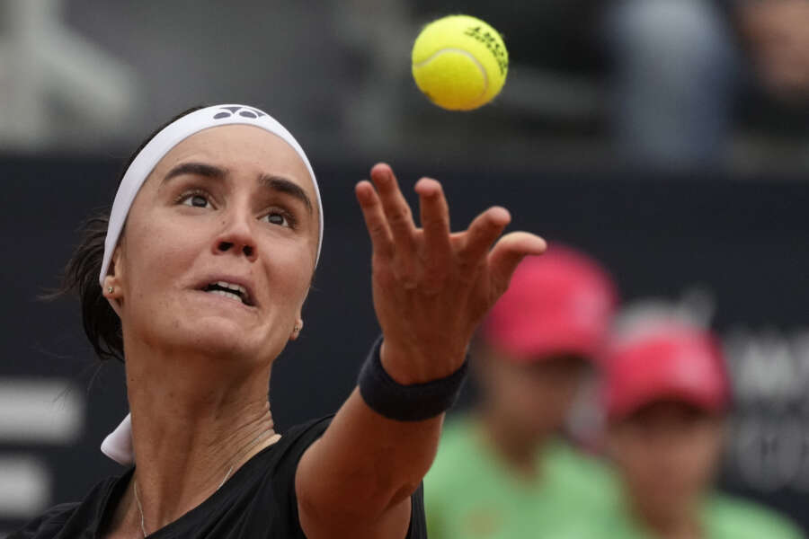 Ukraine’s Anhelina Kalinina serves the ball during a semi final match against Russia’s Veronika Kudermetova at the Italian Open tennis tournament in Rome, Italy, Friday, May 19, 2023. (AP Photo/Alessandra Tarantino)