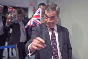 British European Parliament member Nigel Farage leaves the hemicycle after addressing European lawmakers during the plenary session at the European Parliament in Brussels, Wednesday, Jan. 29, 2020. The U.K. is due to leave the EU on Friday, Jan. 31, 2020, the first nation in the bloc to do so. (AP Photo/Francisco Seco)