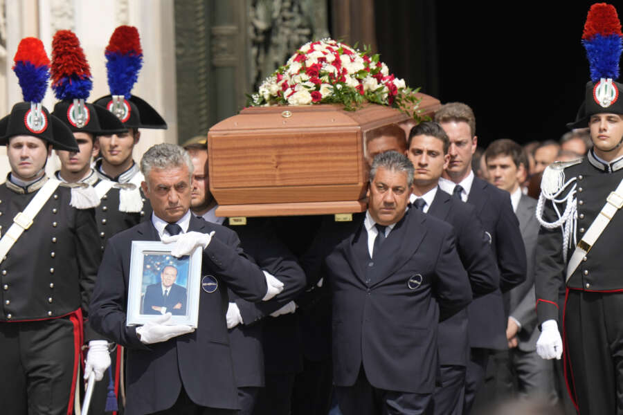 The coffin of media mogul and former Italian Premier Silvio Berlusconi leaves the Milan’s Gothic Cathedral at the end his state funeral in northern Italy, Wednesday, June 14, 2023. Berlusconi died at the age of 86 on Monday in a Milan hospital where he was being treated for chronic leukemia. (AP Photo/Luca Bruno)