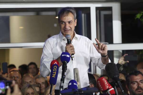 Kyriakos Mitsotakis leader of the center-right New Democracy speaks to supporters outside the headquarters of the party in Athens, Greece, Sunday, June 25, 2023. Greece’s conservative New Democracy party has won a landslide victory in the country’s second election in five weeks, with partial official results showing it gaining a comfortable parliamentary majority to form a government for a second four-year term. (AP Photo/Yorgos Karahalis) Kyriakos Mitsotakis leader of the center-right New Democracy speaks to supporters outside the headquarters of the party in Athens, Greece, Sunday, June 25, 2023. Greece’s conservative New Democracy party has won a landslide victory in the country’s second election in five weeks, with partial official results showing it gaining a comfortable parliamentary majority to form a government for a second four-year term. (AP Photo/Yorgos Karahalis)