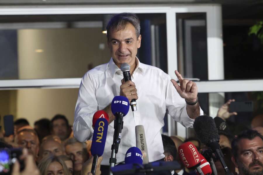 Kyriakos Mitsotakis leader of the center-right New Democracy speaks to supporters outside the headquarters of the party in Athens, Greece, Sunday, June 25, 2023. Greece’s conservative New Democracy party has won a landslide victory in the country’s second election in five weeks, with partial official results showing it gaining a comfortable parliamentary majority to form a government for a second four-year term. (AP Photo/Yorgos Karahalis)