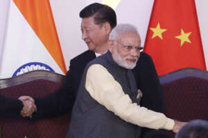 In this Oct. 16, 2016, file photo, Indian Prime Minister Narendra Modi, front and Chinese President Xi Jinping shake hands with leaders at the BRICS summit in Goa, India. Modi made an unannounced visit Friday, July 3, 2020, to a military base in remote Ladakh region bordering China where the soldiers of the two countries have been facing off for nearly two months. Modi’s visit comes in the backdrop of massive Indian army build-up in Ladakh region following hand-to-hand combat between Indian and Chinese soldiers on June 15 that left 20 Indian soldiers dead and dozens injured, the worst military confrontation in over four decades between the Asian giants. (AP Photo/Manish Swarup, File)