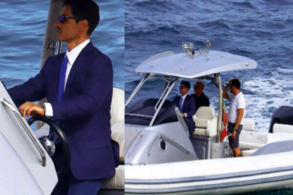 Pier Silvio Berlusconi versione James Bond: brusca interruzione delle vacanze estive. Abbandona la barca e sfreccia in abito alla guida del tender