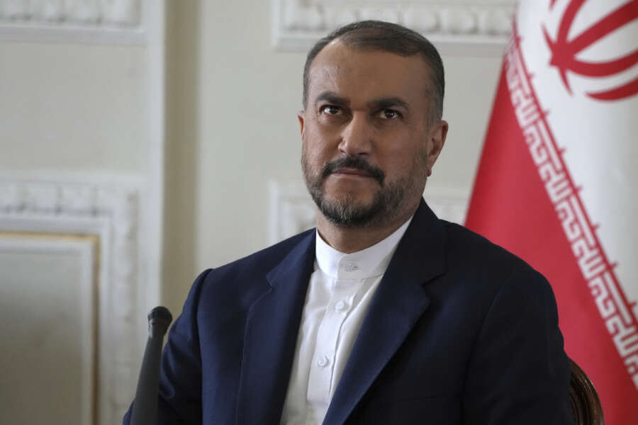 Iranian Foreign Minister Hossein Amirabollahian sits at his press conference in Tehran, Iran, Sunday, March 19, 2023. (AP Photo/Vahid Salemi)