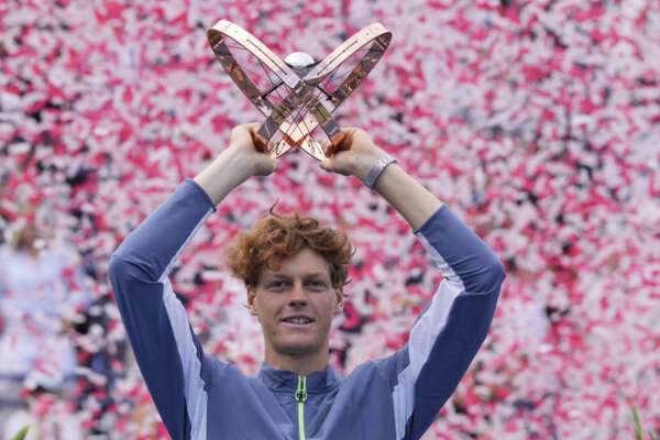 Jannik Sinner, of Italy, holds the trophy after defeating Alex de Minaur, of Australia, to win the men’s final of the National Bank Open tennis tournament in Toronto, Sunday, Aug. 13, 2023. (Frank Gunn/The Canadian Press via AP)
