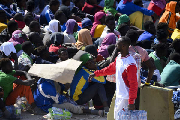 Migrants stand in the Lampedusa’s migrant reception center, Sicily, Thursday, Sept.14, 2023. The reception center in Italy’s southernmost island of Lampedusa remained critical Thursday as it coped with transferring to the mainland thousands of migrants who arrived on small, unseaworthy boats in a 24-hour span this week. (AP Photo/Valeria Ferraro)

Associated Press/LaPresse
Only Italy and Spain