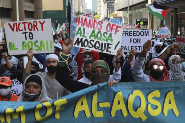 South Africans protest against Israeli attacks on Palestinians in Gaza, outside parliament in Cape Town, South Africa, Wednesday, May 12, 2021. Violence escalated between Israel and Palestine sparked by unrest at Jerusalem’s flashpoint Al-Aqsa Mosque. (AP Photo/Nardus Engelbrecht) South Africans protest against Israeli attacks on Palestinians in Gaza, outside parliament in Cape Town, South Africa, Wednesday, May 12, 2021. Violence escalated between Israel and Palestine sparked by unrest at Jerusalem’s flashpoint Al-Aqsa Mosque. (AP Photo/Nardus Engelbrecht)