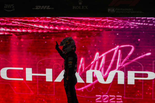 Red Bull driver Max Verstappen of the Netherlands celebrates as he became F1 drivers world champion after the sprint race ahead of the Qatar Formula One Grand Prix at the Lusail International Circuit, in Lusail, Qatar, Saturday, Oct. 7, 2023. (AP Photo/Darko Bandic, Pool)