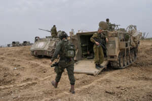 Israeli soldiers are seen at a staging area near the Israeli-Gaza border, in southern Israel, Thursday, Dec. 28, 2023. The army is battling Palestinian militants across Gaza in the war ignited by Hamas’ Oct. 7 attack into Israel. (AP Photo/Ohad Zwigenberg)