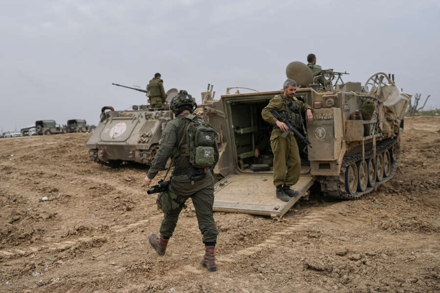 Israeli soldiers are seen at a staging area near the Israeli-Gaza border, in southern Israel, Thursday, Dec. 28, 2023. The army is battling Palestinian militants across Gaza in the war ignited by Hamas’ Oct. 7 attack into Israel. (AP Photo/Ohad Zwigenberg)