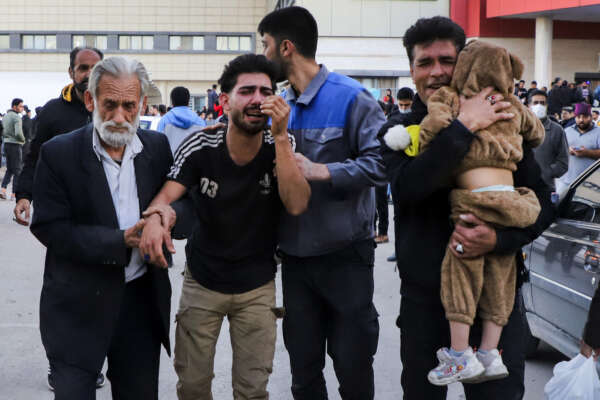 Families of victims of the explosions gather at the courtyard of a hospital in the city of Kerman, about 510 miles (820 kilometres) southeast of the capital Tehran, Iran, Wednesday, Jan. 3, 2024. Two bombs exploded Wednesday at a commemoration for a prominent Iranian general slain by the U.S. in a 2020 drone strike, Iranian officials said, as the Middle East remains on edge over Israel’s war on Hamas in the Gaza Strip. (Sare Tajalli, ISNA via AP)