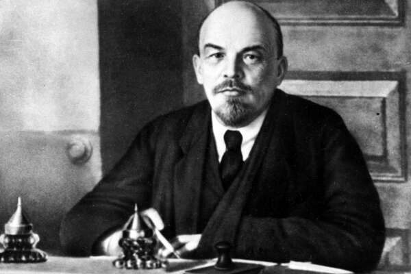 FILE – Vladimir Lenin, the founder of the Soviet Union is shown in at work at an unknown location of Russia in 1918. Shortly after his death in 1924, a poet proclaimed words that thrilled the grieving country: “Lenin lived, Lenin lives, Lenin will live.” But a century later, Lenin is largely an afterthought in modern Russia. (AP Photo, File)