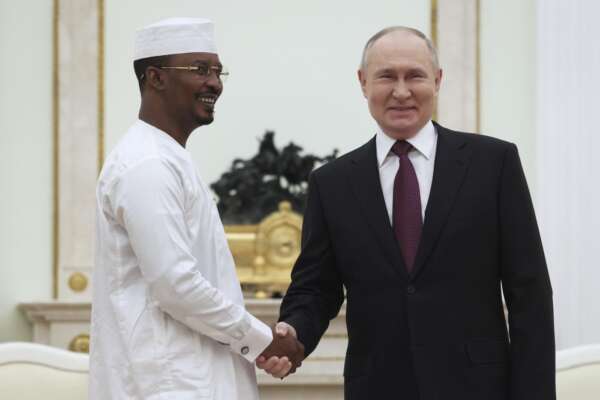 Russian President Vladimir Putin, right, and interim President of Chad Mahamat Idriss Deby shake hands during their meeting in the Kremlin, in Moscow, Russia, Wednesday, Jan. 24, 2024. (Mikhail Metzel, Sputnik, Kremlin Pool Photo via AP)