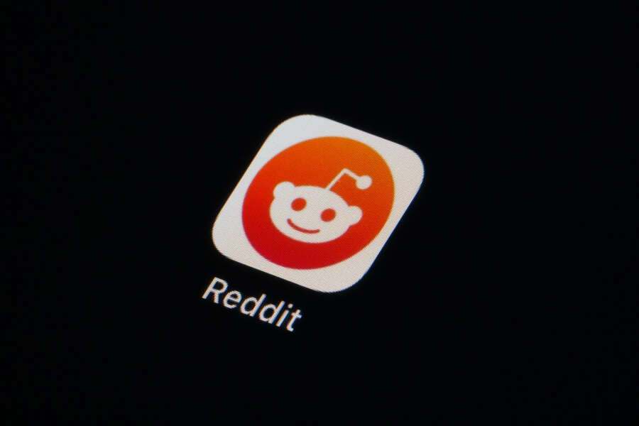 The Reddit app icon is seen on a smartphone, Tuesday, Feb. 28, 2023, in Marple Township, Pa. Reddit is facing an ongoing blackout from some of its most active users. After outrage erupted over plans to charge some third party apps for API, thousands of communities within the online discussion network went dark this week — and many organizers say their protest is not over.  (AP Photo/Matt Slocum)