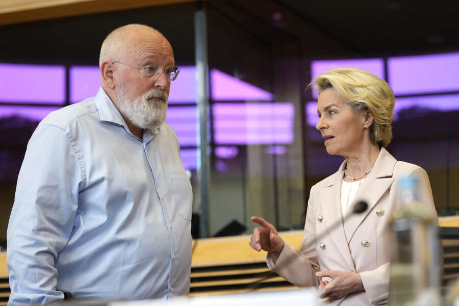 European Commission President Ursula von der Leyen, right, speaks with European Commissioner for European Green Deal Frans Timmermans during the weekly College of Commissioners meeting at EU headquarters in Brussels on Wednesday, July 20, 2022. European Union Commissioners started to put the finishing touches early Wednesday on a drastic plan to make sure that any Russian cut off of its vast natural gas supplies to the bloc will not disrupt industries and send an additional chill through homes next winter. (AP Photo/Virginia Mayo)