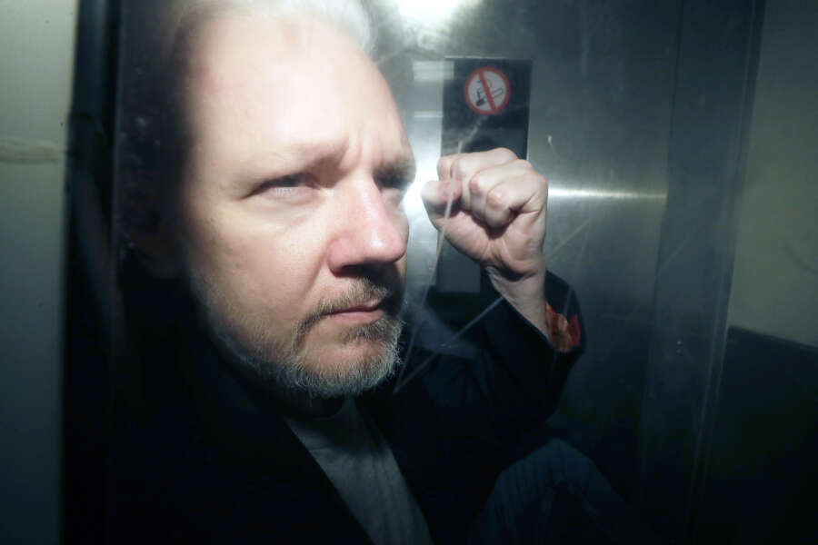FILE – WikiLeaks founder Julian Assange being taken from court, where he appeared on charges of jumping British bail seven years ago, in London, Wednesday May 1, 2019. A London court is due to rule whether WikiLeaks founder Julian Assange can challenge extradition to the United States on espionage charges. Two judges will issue a ruling Tuesday morning in the High Court on whether Assange can make one final appeal in England. (AP Photo/Matt Dunham, File)