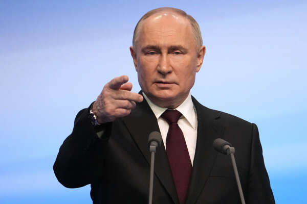Russian President Vladimir Putin speaks on a visit to his campaign headquarters after a presidential election in Moscow, early Monday, March 18, 2024. (AP Photo/Alexander Zemlianichenko)