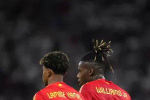 Spain’s Lamine Yamal and Nico Williams, right, stand side by side during the final match between Spain and England at the Euro 2024 soccer tournament in Berlin, Germany, Sunday, July 14, 2024. (AP Photo/Manu Fernandez)