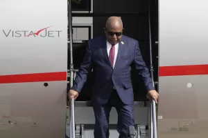 Comoros’ President Azali Assoumani steps out from a plane as he arrives at the Beijing Capital International Airport to attend the China Africa Forum, in Beijing, Sunday, Sept. 1, 2024. (AP Photo/Andy Wong, Pool)