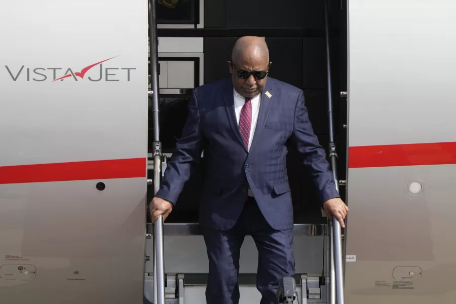 Comoros’ President Azali Assoumani steps out from a plane as he arrives at the Beijing Capital International Airport to attend the China Africa Forum, in Beijing, Sunday, Sept. 1, 2024. (AP Photo/Andy Wong, Pool)