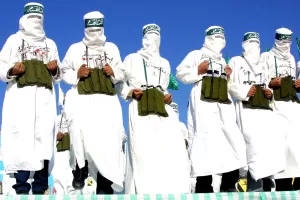 ©LAPRESSE
13-12-2002 KHAN YOUNIS, STRISCIA DI GAZA, GAZA
ESTERO
QUINDICESIMO ANNIVERSARIO DELLA FONDAZIONE DEL GRUPPO MILITANTE ISLAMICO HAMAS.
ALLA MANIFESTAZIONE, CHE SI E’ TENUTA NEL CAMPO PROFUGHI, HANNO PARTECIPATO PIU’ DI 30.000 PERSONE.
NELLA FOTO: HAMAS MASCHERATI VESTITI DA ATTENTATORI SUICIDA SIMULANO I KAMIKAZE ©LAPRESSE
13-12-2002 KHAN YOUNIS, STRISCIA DI GAZA, GAZA
ESTERO
QUINDICESIMO ANNIVERSARIO DELLA FONDAZIONE DEL GRUPPO MILITANTE ISLAMICO HAMAS.
ALLA MANIFESTAZIONE, CHE SI E’ TENUTA NEL CAMPO PROFUGHI, HANNO PARTECIPATO PIU’ DI 30.000 PERSONE.
NELLA FOTO: HAMAS MASCHERATI VESTITI DA ATTENTATORI SUICIDA SIMULANO I KAMIKAZE