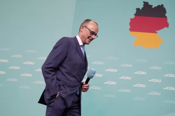 Friedrich Merz, the candidate of the mainstream conservative Christian Democratic Union party, arrives on stage to address supporters at the party headquarters in Berlin, Germany, Sunday, Feb. 23, 2025, after the German national election. (AP Photo/Markus Schreiber)
