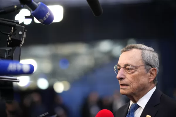 Former Central Bank President Mario Draghi speaks with the media as he arrives for an EU Summit at the Puskas Arena in Budapest, Hungary, Friday, Nov. 8, 2024. (AP Photo/Petr David Josek)
