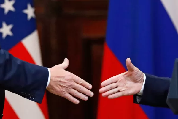 FILE – U.S. President Donald Trump shakes hands with Russian President Vladimir Putin at the end of a news conference following their meeting at the Presidential Palace in Helsinki, Finland, on July 16, 2018. (AP Photo/Alexander Zemlianichenko, File)