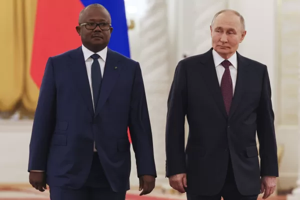 Guinea-Bissau’s President Umaro Sissoco Embalo, left, and Russian President Vladimir Putin walk during their meeting at the Kremlin in Moscow, Russia, Wednesday, Feb. 26, 2025. (Yury Kochetkov/Pool Photo via AP)