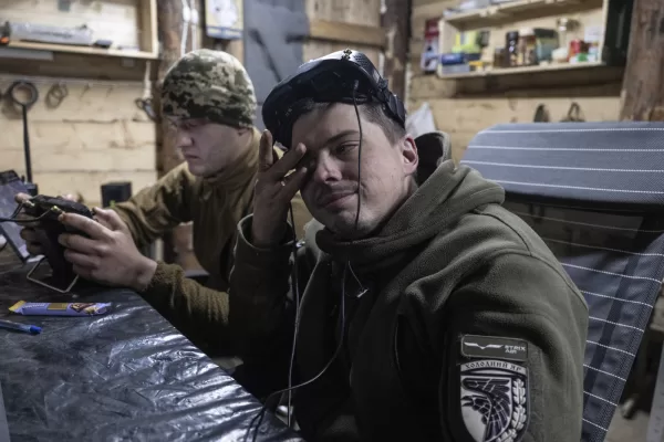 In this photo provided by Ukraine’s 93rd Kholodnyi Yar Separate Mechanized Brigade press service, soldiers operate an FPV drones in a shelter in Kramatorsk direction, Donetsk region, Ukraine, Saturday, March 22, 2025. (Iryna Rybakova/Ukraine’s 93rd Mechanized Brigade via AP)