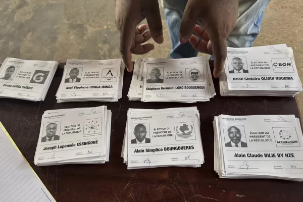 Ballots for presidential candidates are placed on a table inside a polling station, in Liberville, Gabon, Saturday, April 12, 2025. (AP Photo/Betines Makosso)