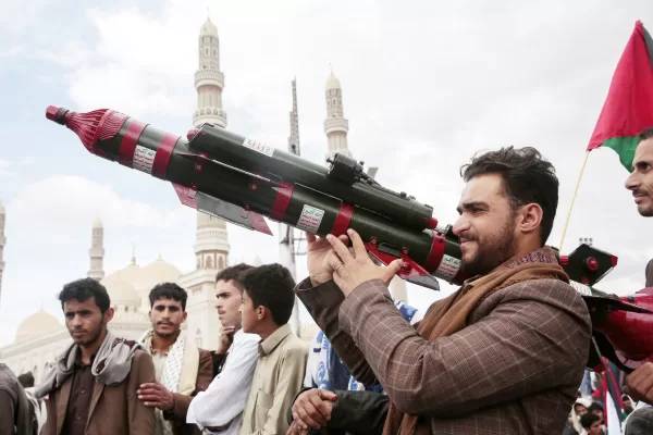 FILE – A Houthi supporter holds a mock missile during a protest marking Jerusalem Day in support of Palestinians in the Gaza Strip, in Sanaa, Yemen, April 5, 2024. (AP Photo/Osamah Abdulrahman, File)