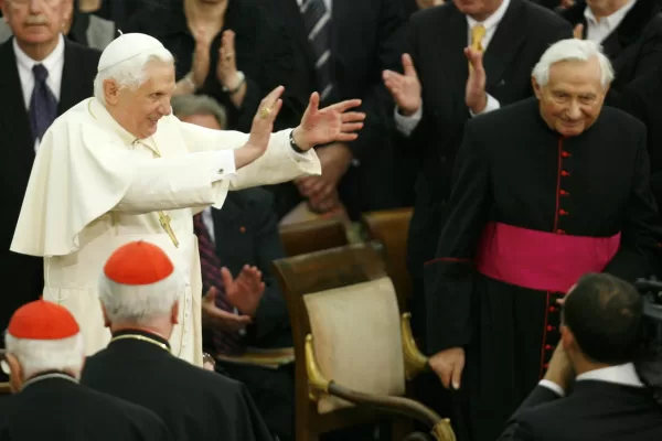 FILE – In this Saturday, Oct. 27, 2007 file photo, Pope Benedict XVI, center left, applauds, as his brother, Georg, right, looks on, during a concert by the German Symphonic Orchestra Bayerischer Rundfunk and the Bamberger Symphoniker, at the Paul VI Hall at the Vatican. The Rev. Georg Ratzinger, the older brother of Emeritus Pope Benedict XVI, who earned renown in his own right as a director of an acclaimed German boys’ choir, has died at age 96. The Regensburg diocese in Bavaria, where Ratzinger lived, said in a statement on his website that he died on Tuesday, June 30, 2020. (AP Photo/Andrew Medichini, File)
