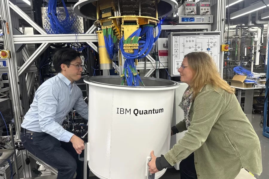 Jerry Chow, IBM Fellow and Director of Quantum Infrastructure, left, and Daniela Bogorin, IBM Quantum Research Engineer, remove the outer chamber from a quantum computer in Yorktown Heights, New York, on Wednesday, March 5, 2025. (AP Photo/Ted Shaffrey)