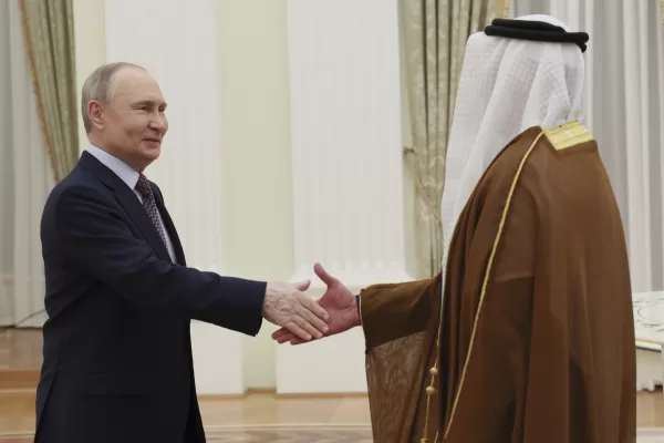 Russian President Vladimir Putin, left, shakes hands with UAE Deputy Prime Minister and Minister of Interior Sheikh Saif bin Zayed Al Nahyan during their meeting at the Kremlin in Moscow, Russia, on Wednesday, April 30, 2025. (Alexander Shcherbak, Sputnik, Kremlin Pool Photo via AP)