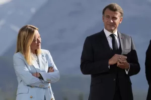 Italy’s Prime Minister Giorgia Meloni and France’s President Emmanuel Macron listen as President Donald Trump answers questions during a group photo at the G7 Summit, Monday, June 16, 2025, in Kananaskis, Canada. (AP Photo/Mark Schiefelbein)