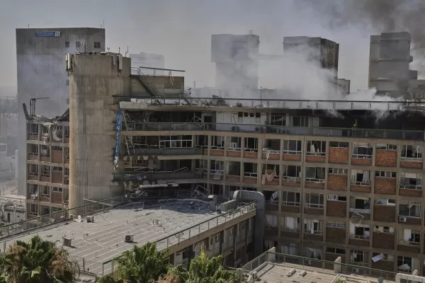Smokes rises from a building of the Soroka hospital complex after it was hit by a missile fired from Iran in Beersheba, Israel, Thursday, June 19, 2025. (AP Photo/Leo Correa)