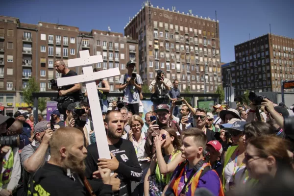 People holding a cross and religious books walk among participants in the Pride march in Budapest, Hungary, Saturday, June 28, 2025. (AP Photo/Rudolf Karancsi) People holding a cross and religious books walk among participants in the Pride march in Budapest, Hungary, Saturday, June 28, 2025. (AP Photo/Rudolf Karancsi)