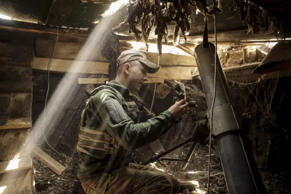 In this photo taken on May 27, 2025 and provided by Ukraine’s 24th Mechanized Brigade press service, a soldier prepares a 120mm mortar to fire towards Russian army positions near Chasiv Yar, Donetsk region, Ukraine, Tuesday, May 27, 2025, (Oleg Petrasiuk/Ukraine’s 24th Mechanized Brigade via AP)