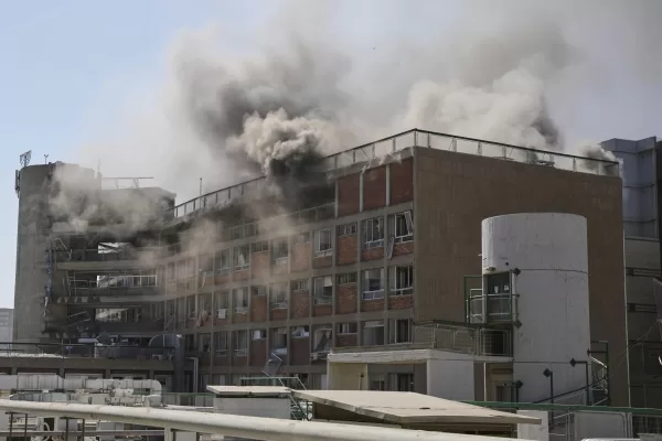 Smokes raises from a building of the Soroka hospital complex after it was hit by a missile fired from Iran in Be’er Sheva, Israel, Thursday, June 19, 2025. (AP Photo/Leo Correa)
