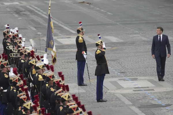 Associated Press/LaPresseFrench President Emmanuel Macron, right, reviews Republican Guards during the Bastille Day parade, Monday, July 14, 2025 in Paris. (AP Photo/Christophe Ena)