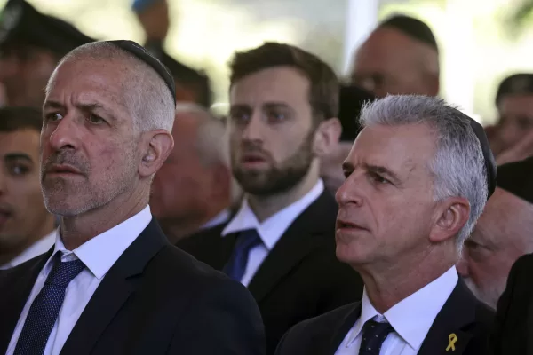 Israel’s Chief of the Mossad David Barnea, right, and Security Agency director Ronen Bar, attend a ceremony marking the Hebrew calendar anniversary of the Hamas attack on October 7 last year, at the Mount Herzl military cemetery in Jerusalem, Israel Sunday Oct. 27, 2024. (Gil Cohen-Magen/Pool Photo via AP)