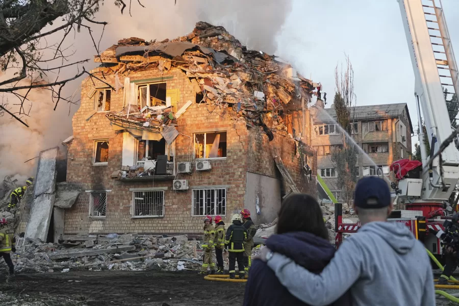 Firefighters work at the site of a burning building after a Russian attack in Kyiv, Ukraine, early Thursday, Aug. 28, 2025. (AP Photo/Efrem Lukatsky)