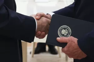 Russian President Vladimir Putin, left, and U.S. President Donald Trump’s special envoy Steve Witkoff, right, shake hands during their meeting at the Kremlin in Moscow, Russia, Wednesday, Aug. 6, 2025. (Gavriil Grigorov, Sputnik, Kremlin Pool Photo via AP)