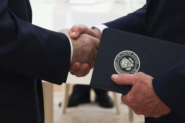 Russian President Vladimir Putin, left, and U.S. President Donald Trump’s special envoy Steve Witkoff, right, shake hands during their meeting at the Kremlin in Moscow, Russia, Wednesday, Aug. 6, 2025. (Gavriil Grigorov, Sputnik, Kremlin Pool Photo via AP)
