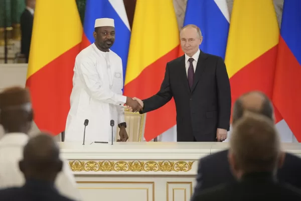 Russian President Vladimir Putin, right, and Interim President of the Republic of Mali Assimi Goita shake hands after a signing ceremony following their talks at the Grand Kremlin Palace at the Kremlin in Moscow, Russia, Monday, June 23, 2025. (AP Photo/Pavel Bednyakov, Pool)