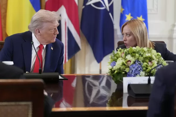 President Donald Trump, left, and Italy’s Prime Minister Giorgia Meloni speak during a meeting with Ukrainian President Volodymyr Zelenskyy and European leaders in the East Room of the White House, Monday, Aug. 18, 2025, in Washington. (AP Photo/Alex Brandon)