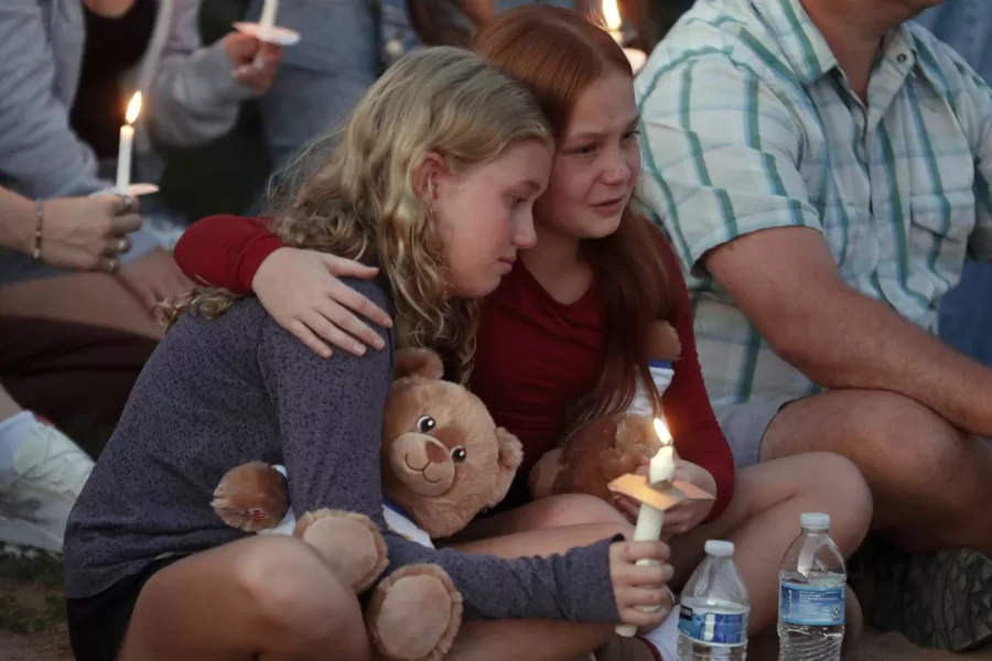 People gather at a vigil at Lynnhurst Park after a shooting at the Annunciation Catholic School, Wednesday, Aug. 27, 2025, in Minneapolis. (AP Photo/Bruce Kluckhohn)