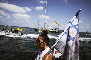 Relatives of Israeli hostages held by Hamas sail along the coast of the Israeli southern city of Ashkelon towards the Gaza Strip, in a protest demanding their release from captivity and calling for an end to the war, Thursday, Aug. 7, 2025. (AP Photo/Leo Correa)