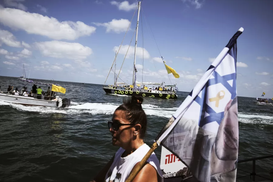 Relatives of Israeli hostages held by Hamas sail along the coast of the Israeli southern city of Ashkelon towards the Gaza Strip, in a protest demanding their release from captivity and calling for an end to the war, Thursday, Aug. 7, 2025. (AP Photo/Leo Correa)
